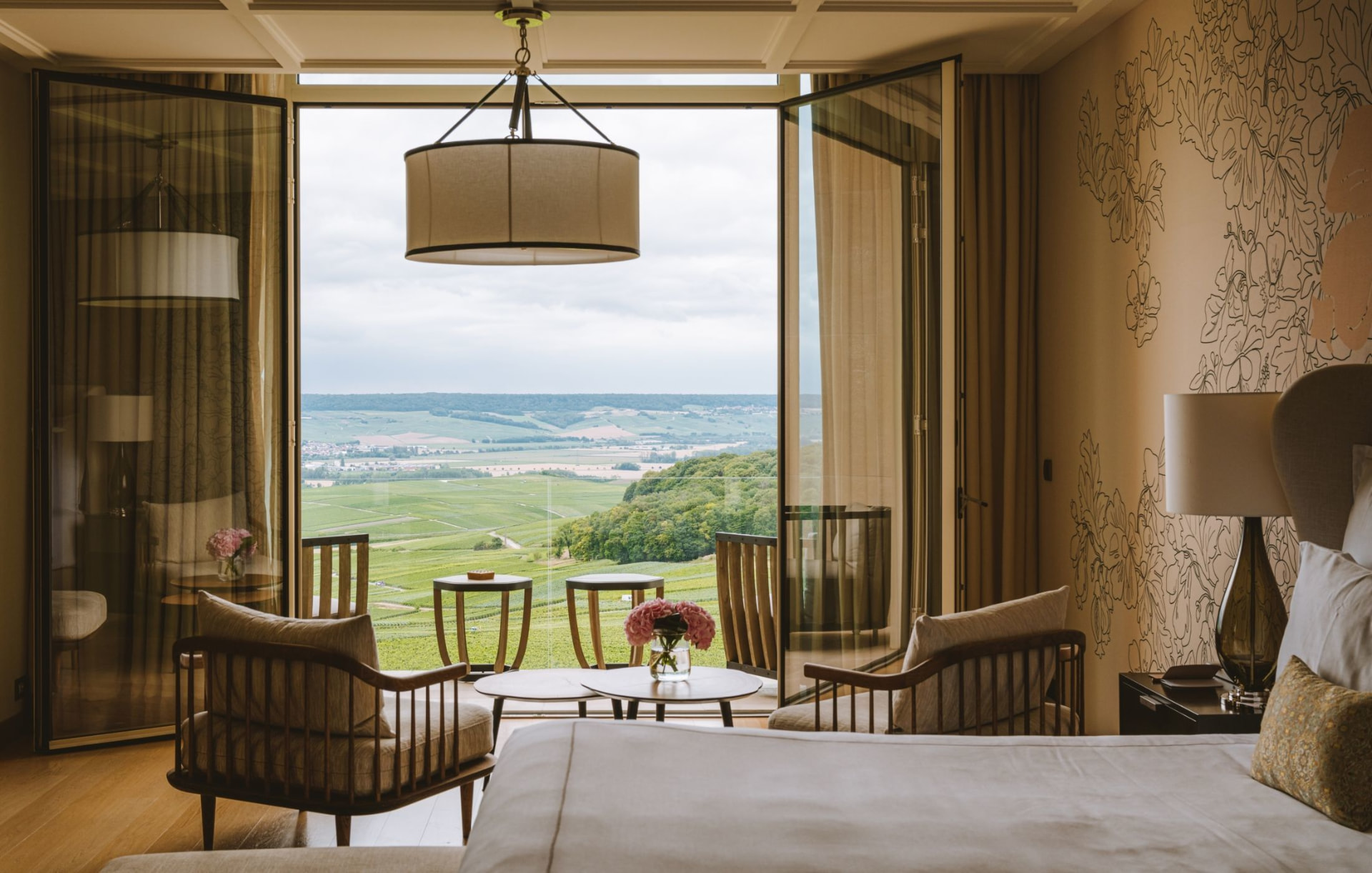 Suite opening onto a balcony above the vineyards